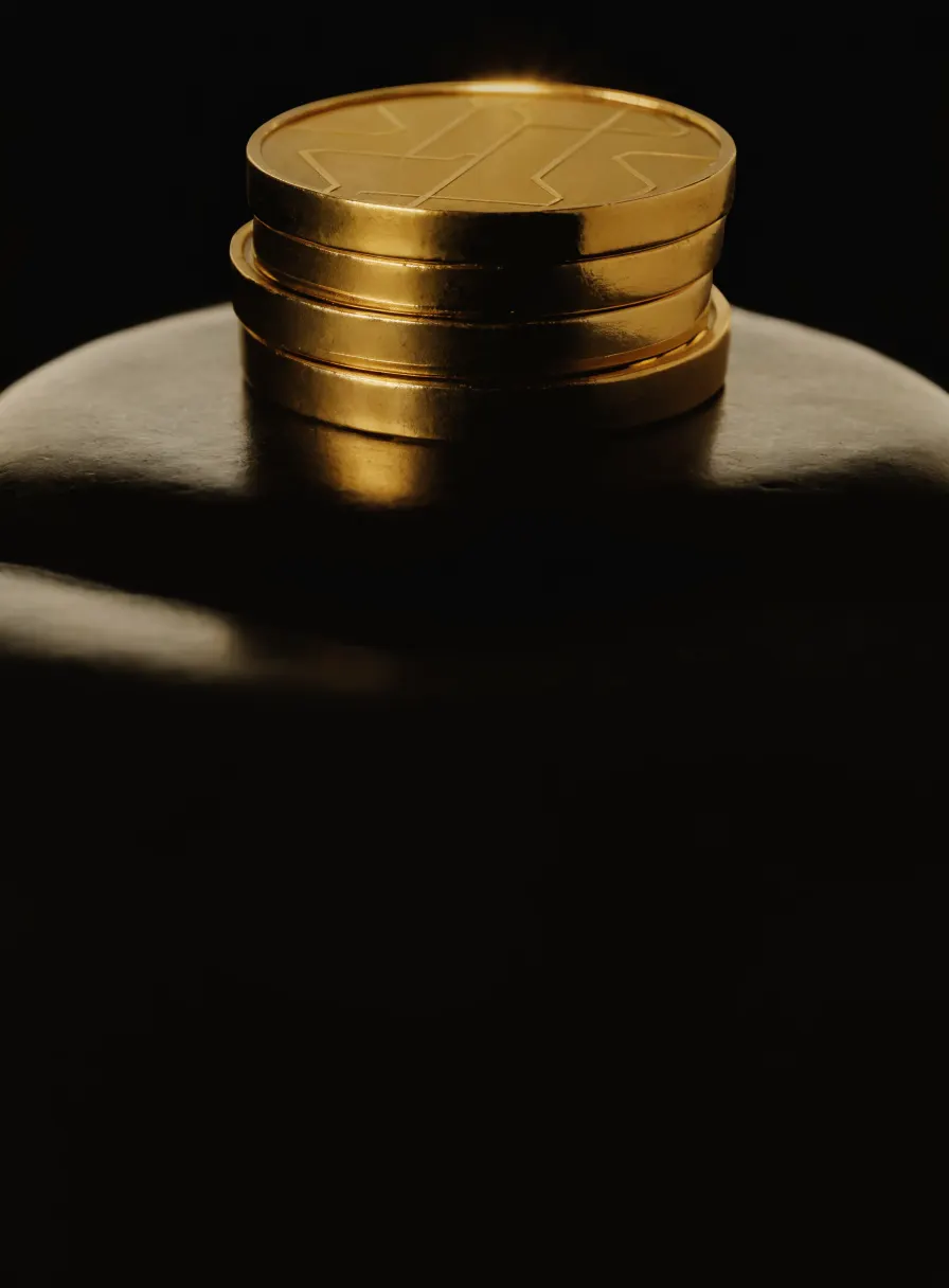 Stack of gold coins with an engraved circuit pattern